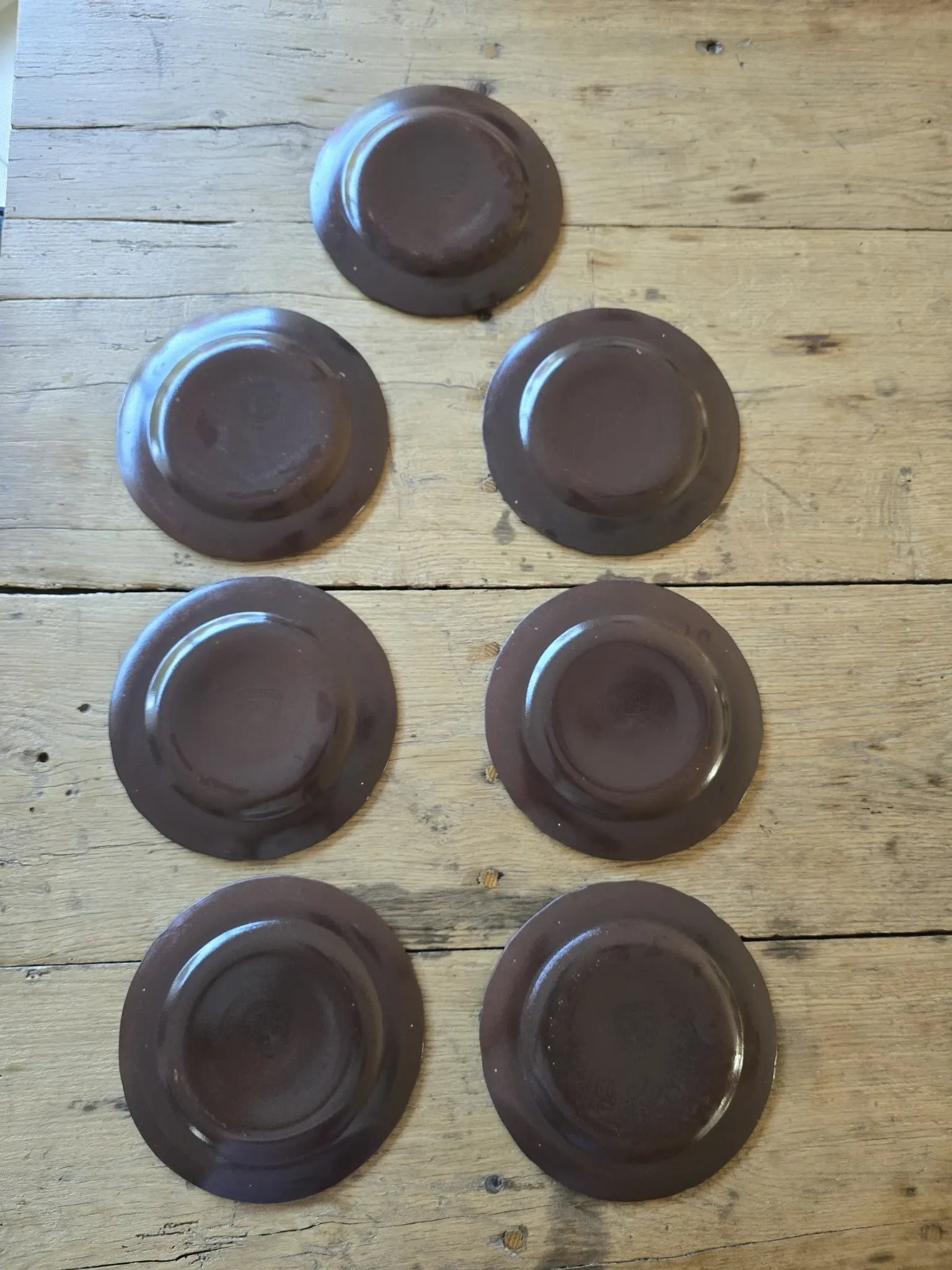 Set of 7 vintage Niderviller "Lys" painted stoneware dessert plates.