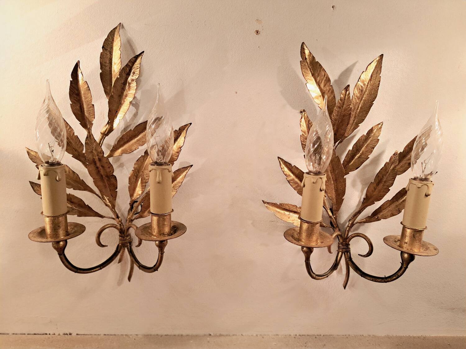 Pair of gold-tone metal leaf wall sconces