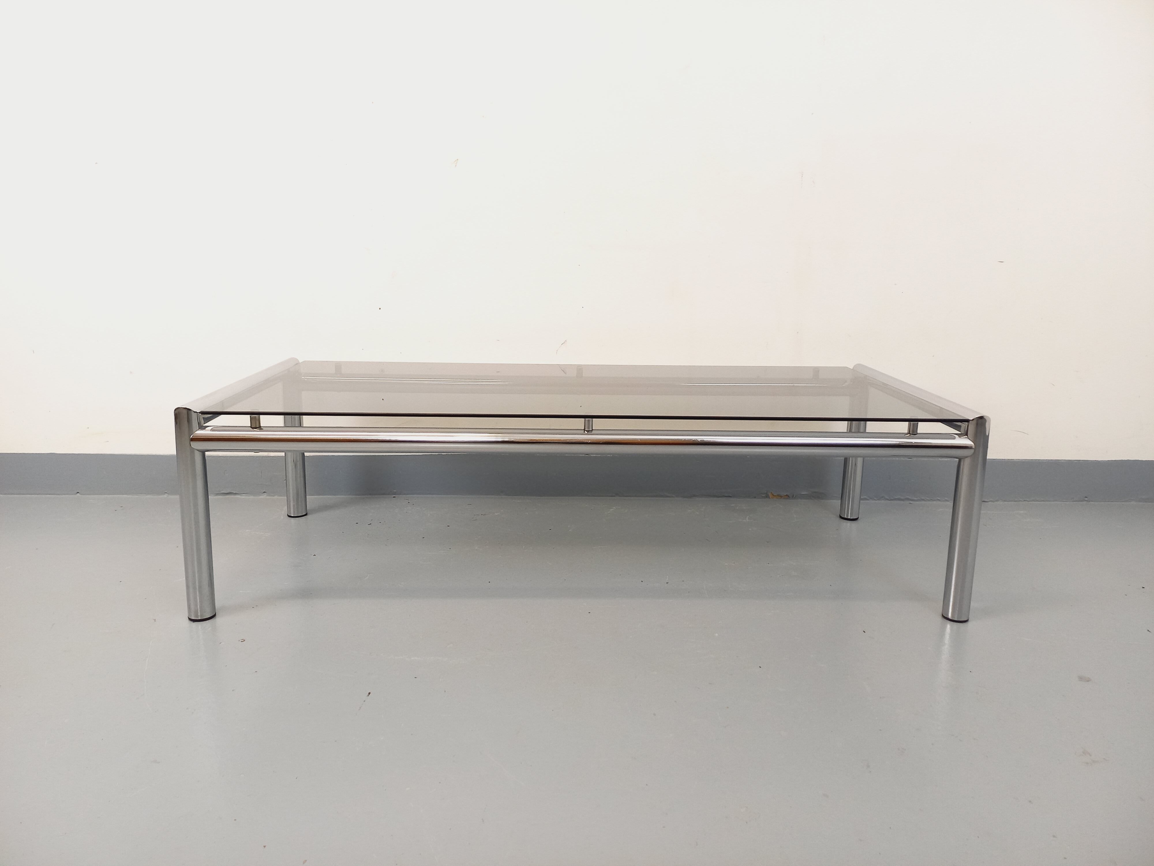 Vintage rectangular coffee table in smoked glass and chrome metal from the 1960s.