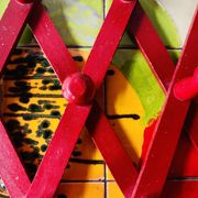 Vintage accordion coat rack in red painted wood
