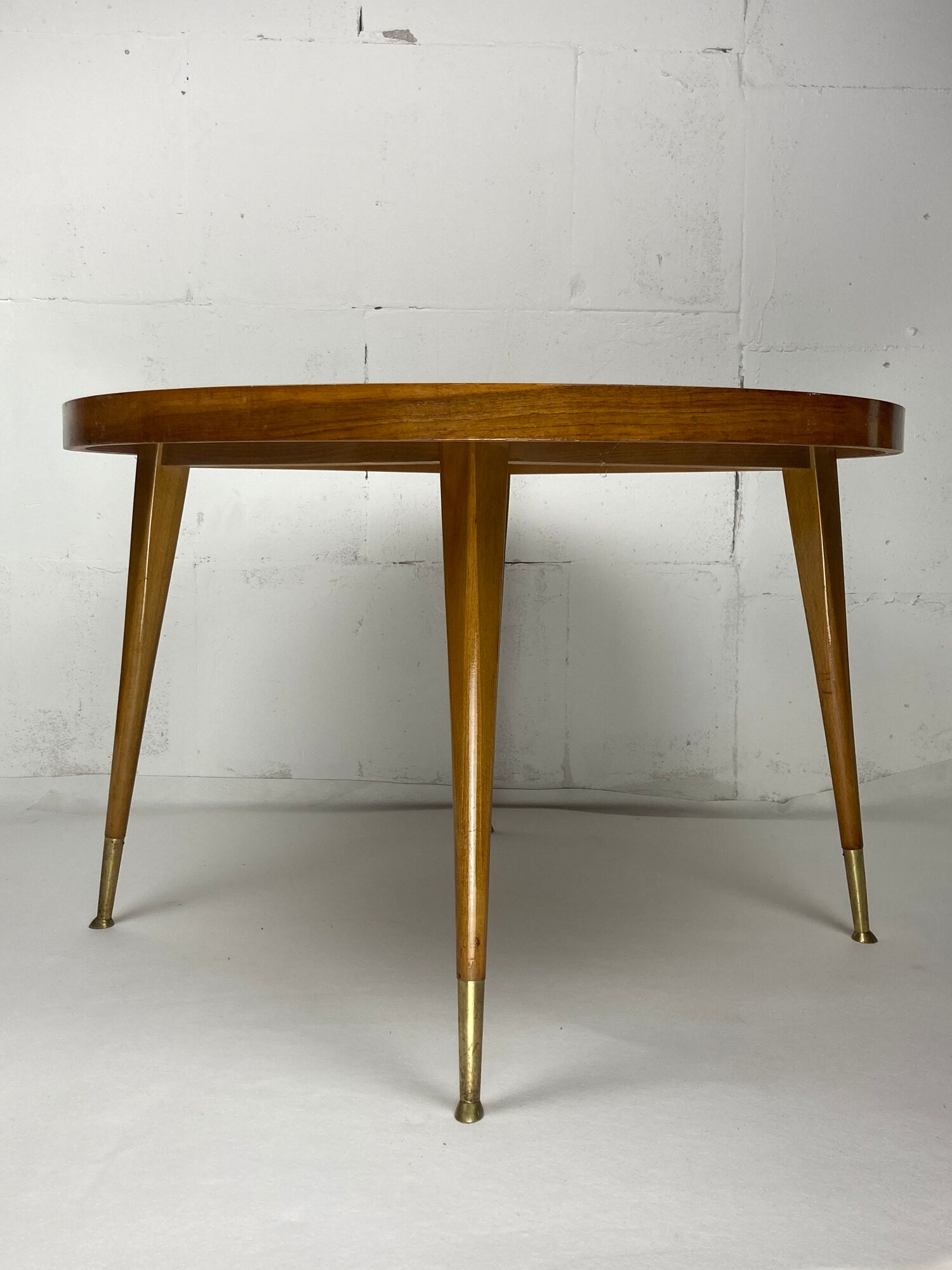 Italian round table with tapered brass leg ends, 1950s
