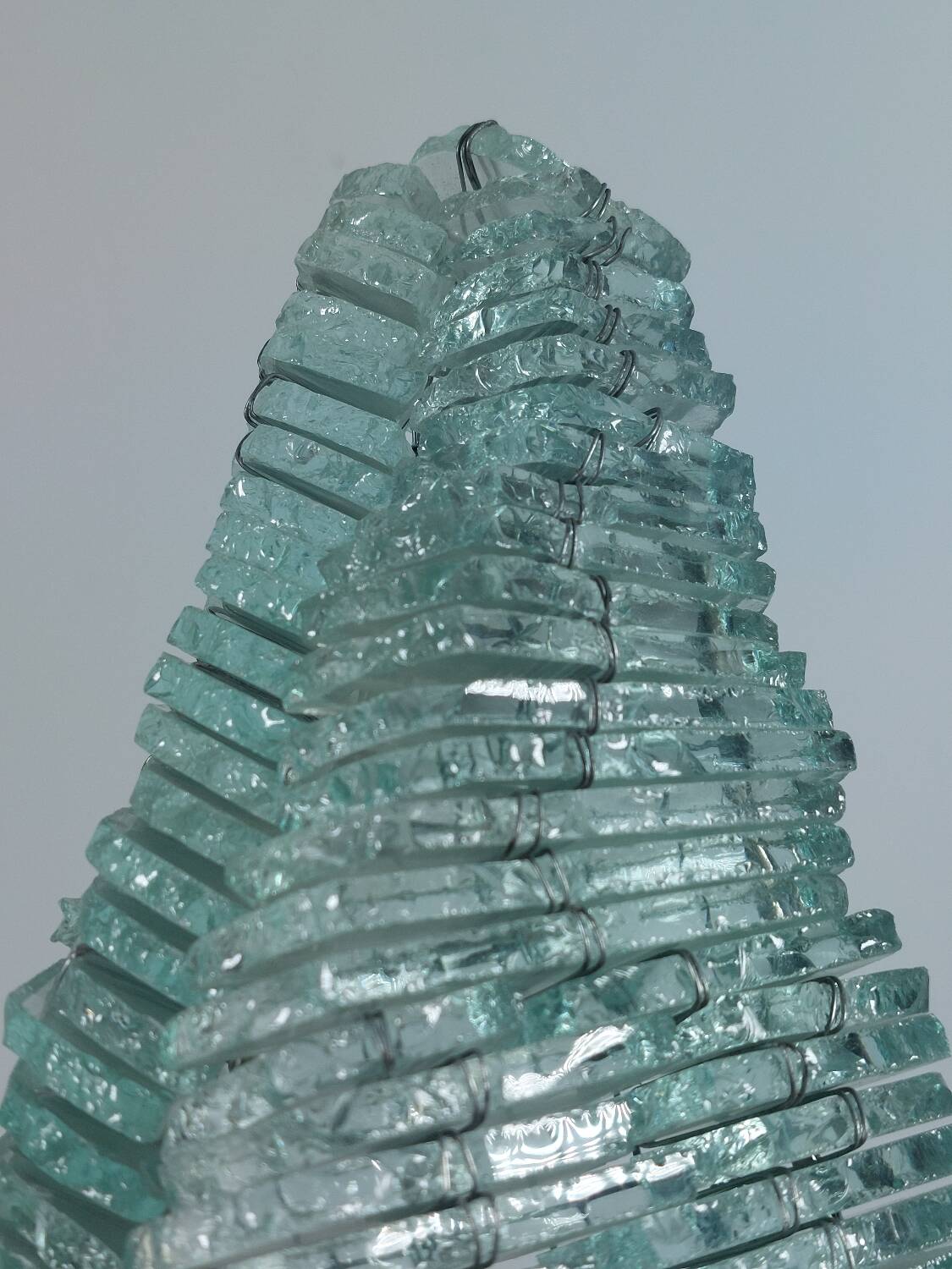 Pair of pyramid-shaped wall sconces in glass in vintage French style.