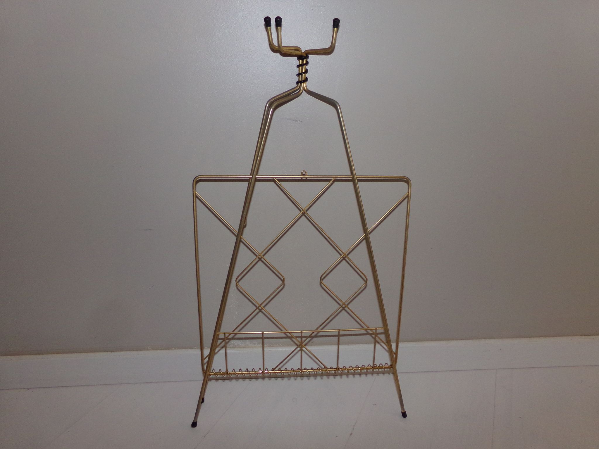 Vintage magazine holder in gold metal