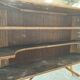 Rattan and wood bar with its decorative brass portholes