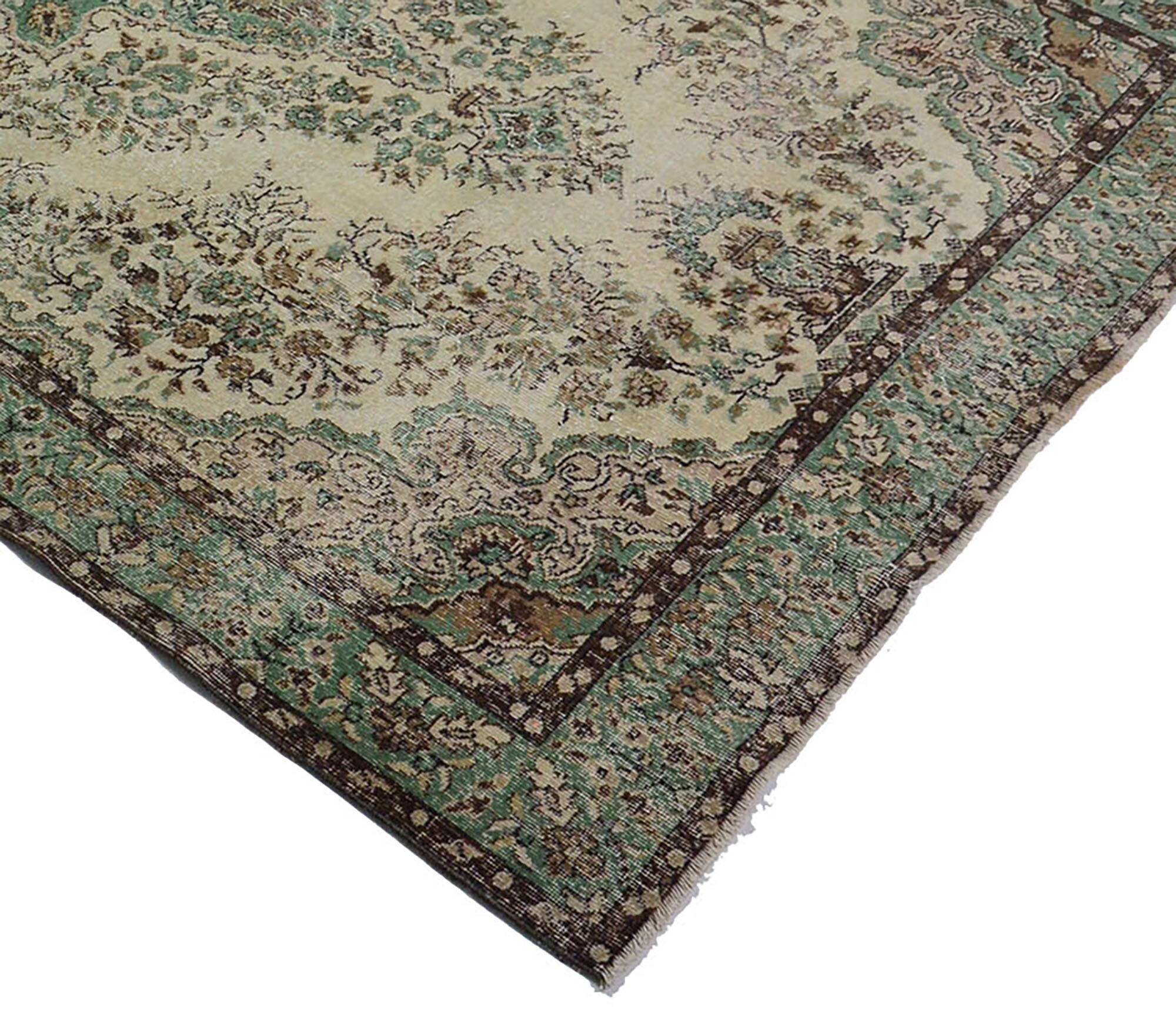 Vintage Oushak rug with green and beige medallion, 345 x 205 cm.