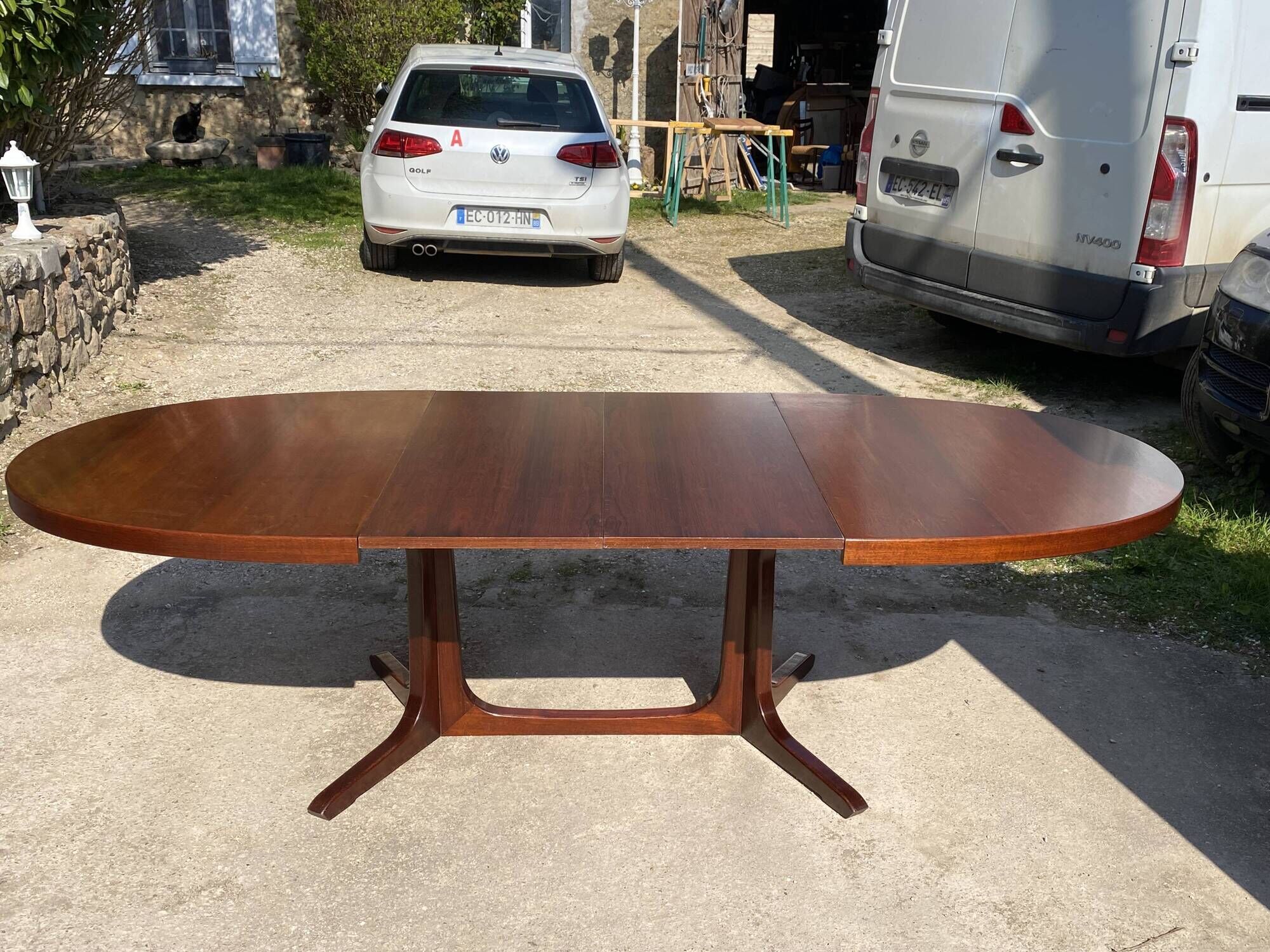 Baumann round oval extendable Scandinavian table in rosewood with 2 extensions.