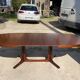 Baumann round oval extendable Scandinavian table in rosewood with 2 extensions.