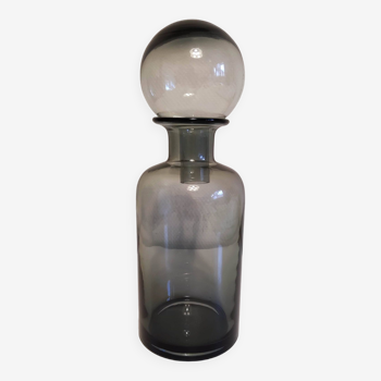 gray glass carafe with stopper