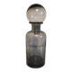 gray glass carafe with stopper