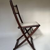 Set de quatre chaises pliantes en bois et cannage