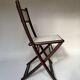 Set de quatre chaises pliantes en bois et cannage