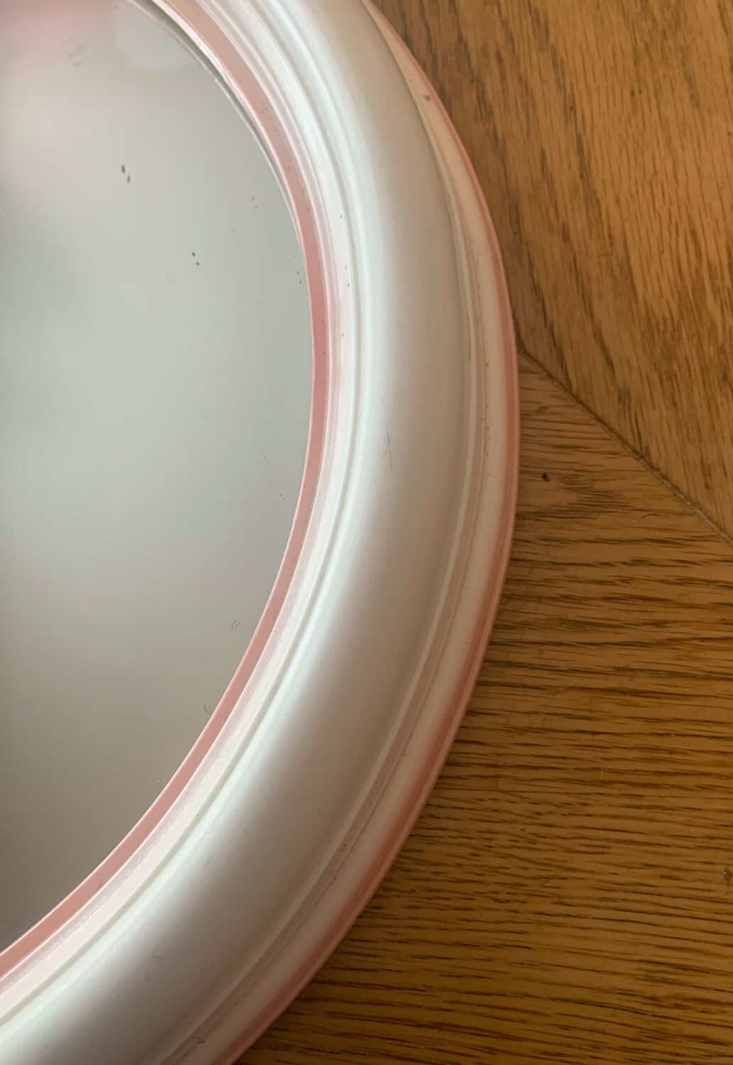 Pink oval mirror