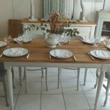 Farmhouse table with pearl gray base and raw wood top.