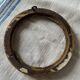 Small round frame in old gilded wood