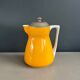 Antique teapot in earthenware with a tin filter lid.