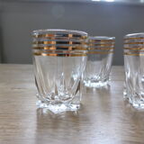 6 clear liquor glasses with golden edict