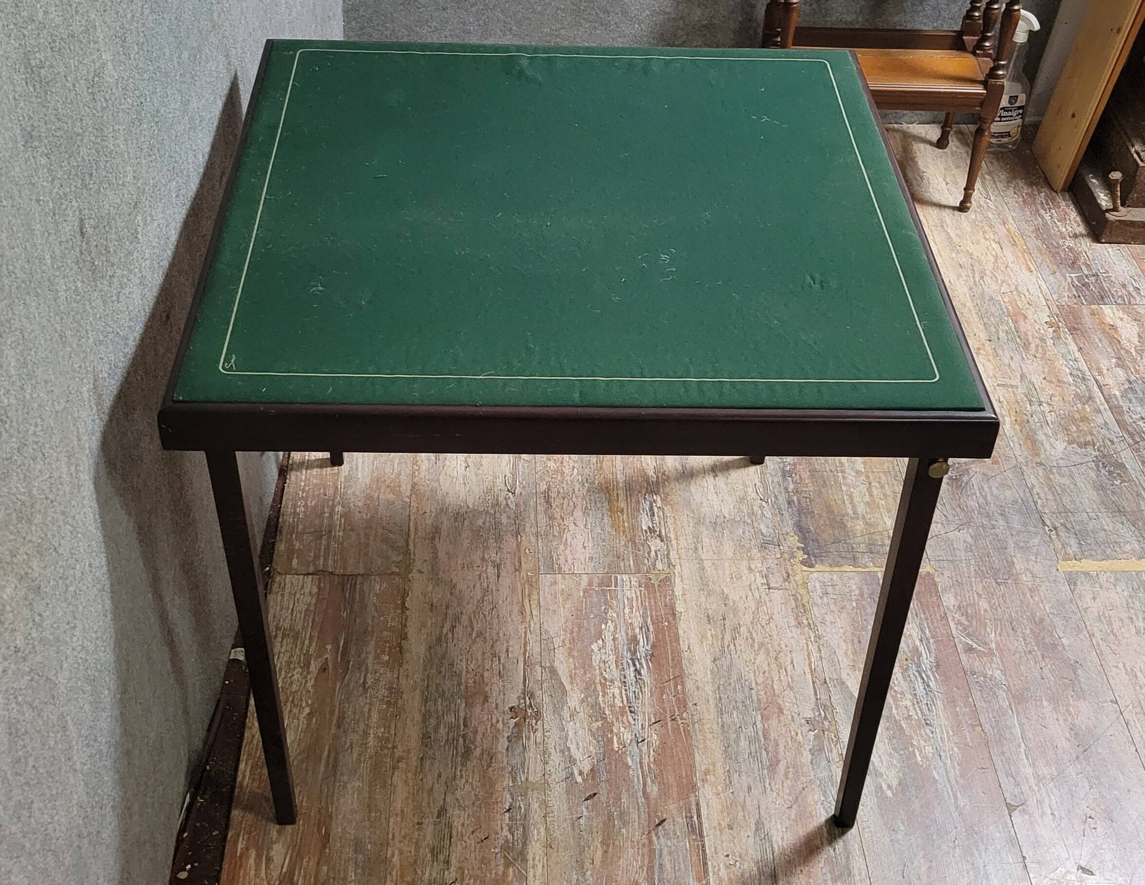 a wooden Bridge game table resting on four thin, straight legs
