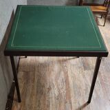 a wooden Bridge game table resting on four thin, straight legs