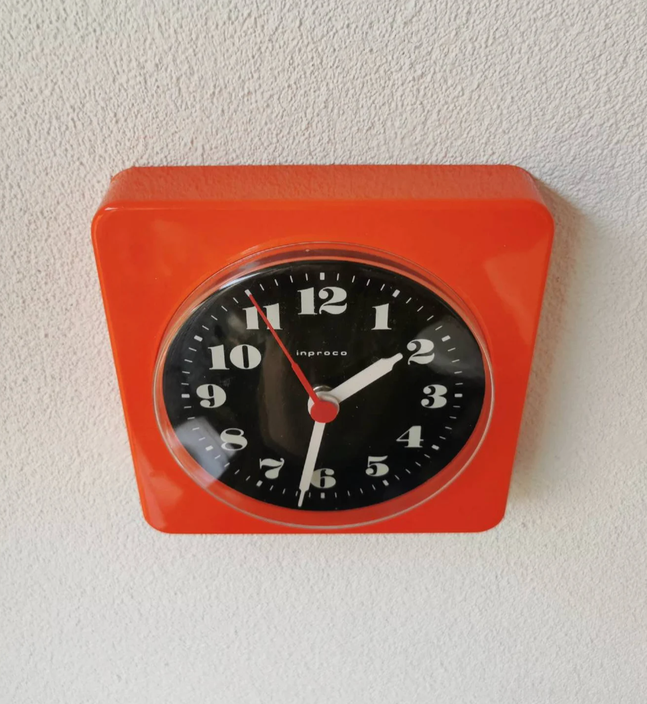 Vintage orange wall clock made of Inproco plastic, 1970