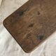 Old low stool made of solid wood