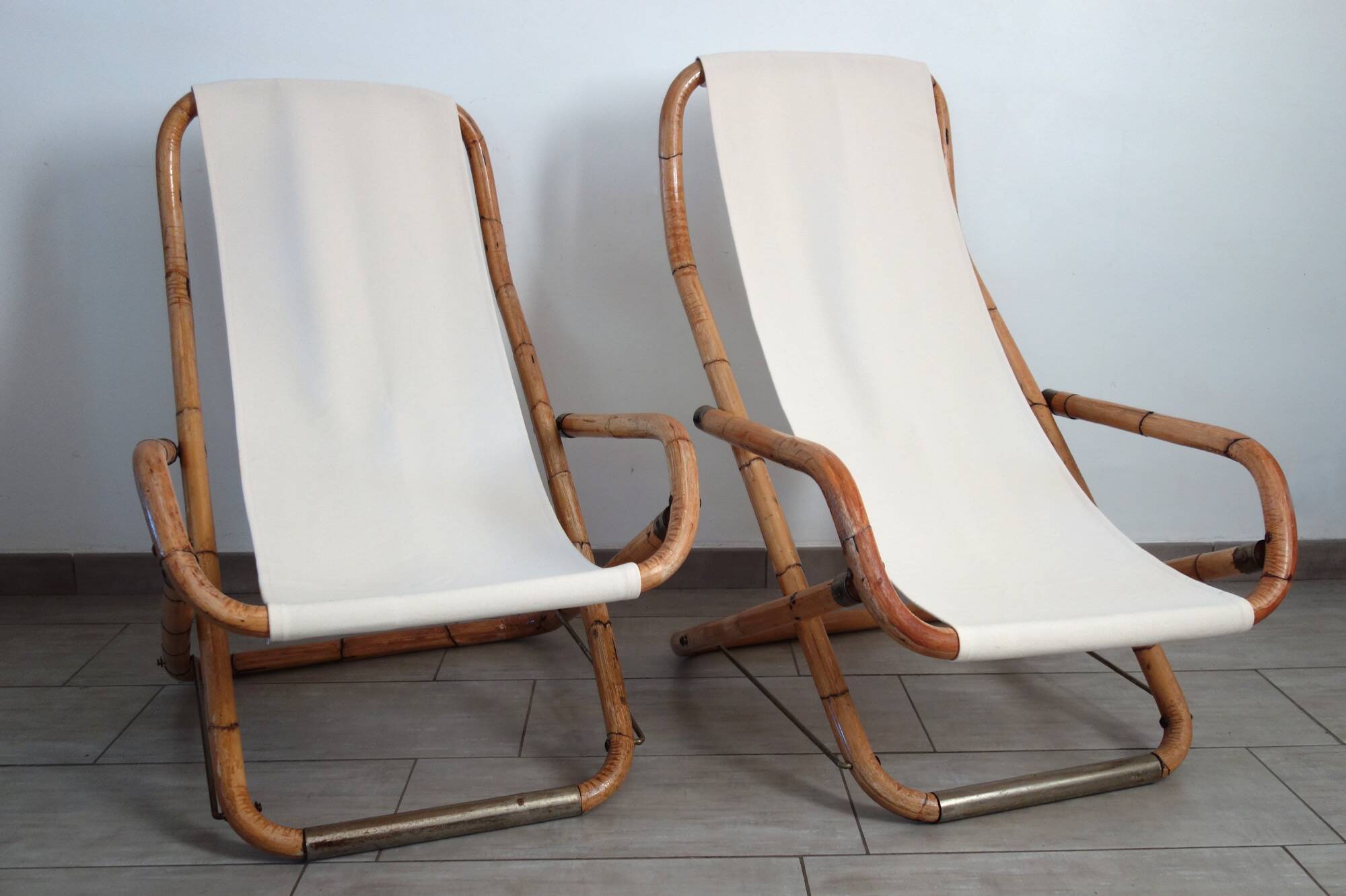 Pair of folding bamboo and brass deck chairs, Italy, 1960s.