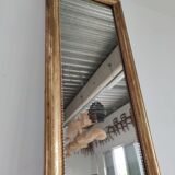 Long wooden mirror and gilded stucco with pearl rays H: 2m45 L: 40cm