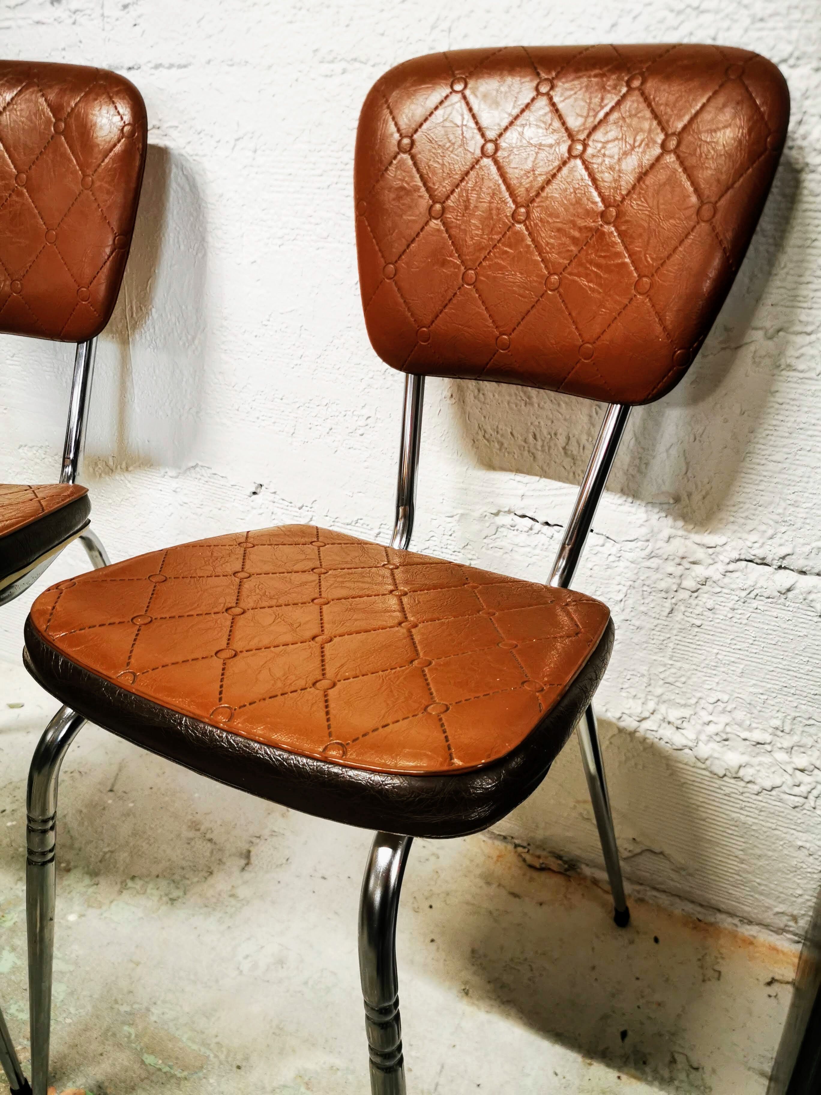 Pair of chrome and skai chairs