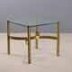 Vintage brass coffee table with glass top, Italian design from the 1970s.