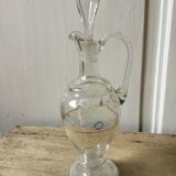 Antique decanter decorated by hand