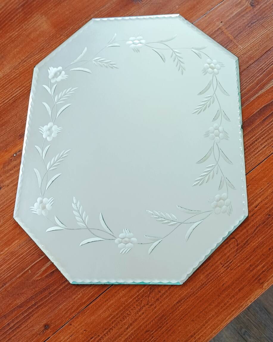 Beveled mirror with floral decor
