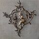 Spark screen, fire screen, bronze fireplace screen decorated with a covered cherub