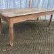 Antique farmhouse table in solid oak with tapered legs and 1 drawer at the end.