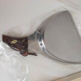 Picks up new vintage shovel and sweeper crumbs