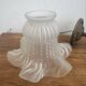Antique bronze wall light in Louis XVI style - tulip-shaped glass paste flower.