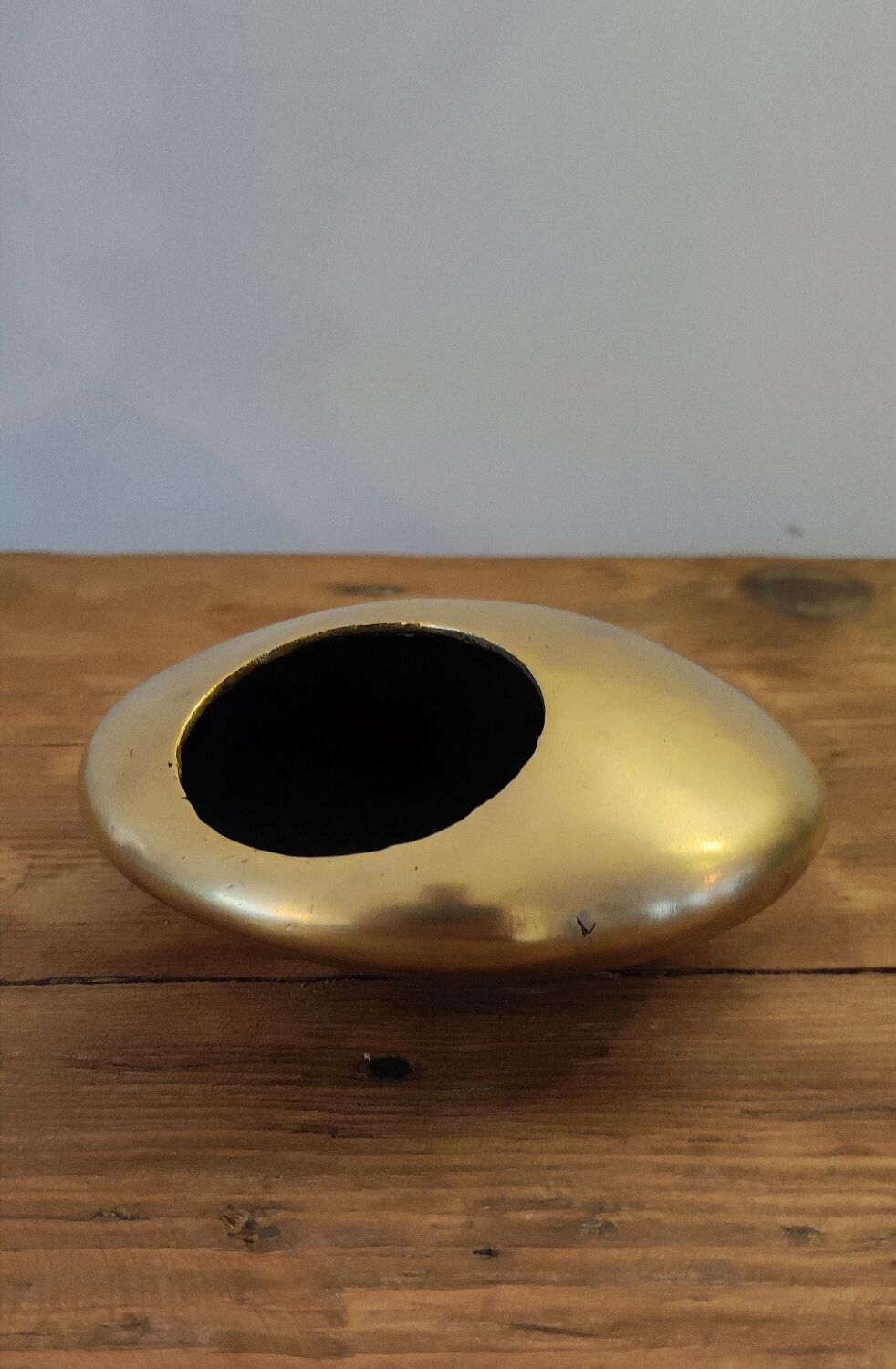 Modernist ashtray pellet in solid bronze.