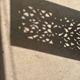 Rectangular Indonesian construction element with blue and yellow plant in carved wood