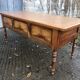 Solid cherry game table with 2 front drawers and panelled crosspieces.