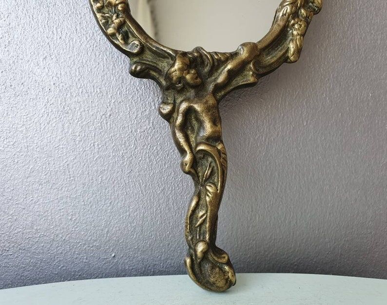 Hand mirror in brass art deco 30 years France
