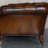 Pair of leather Chesterfield sofas by Howard & Sons