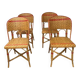 Set of 4 antique chairs in woven red and natural rattan.