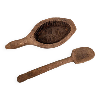 Butter mold and wooden spoon