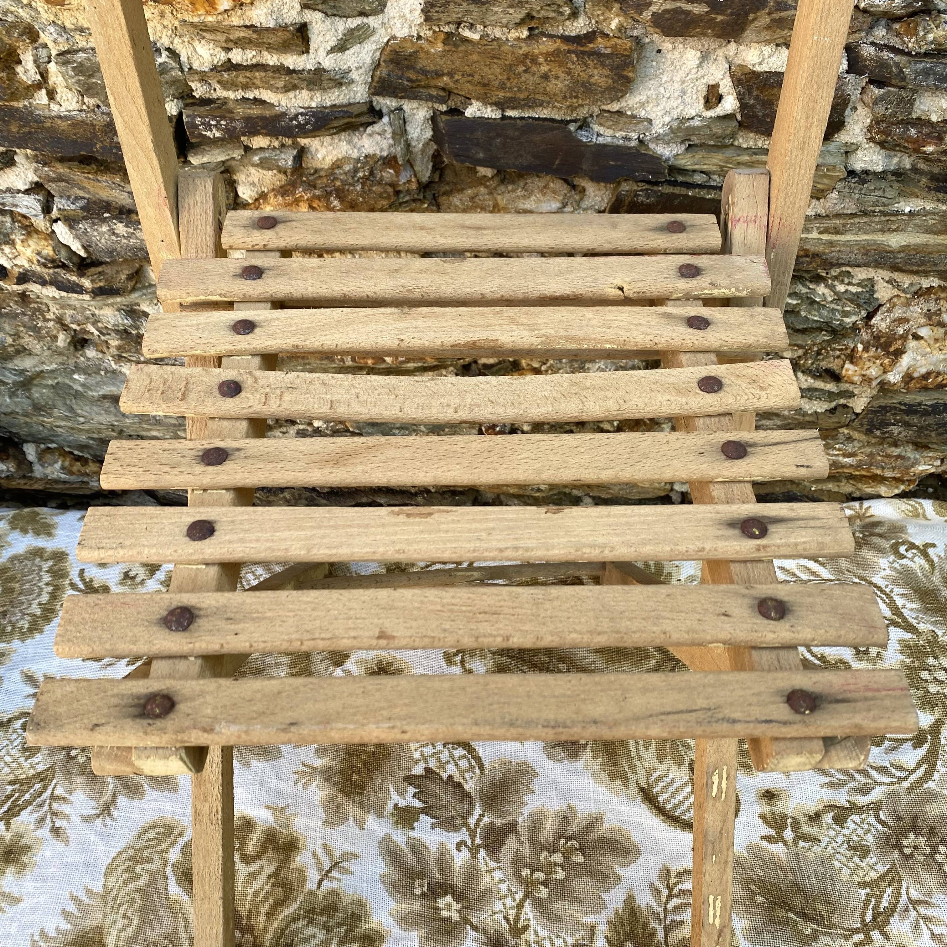 Antique folding chair with wooden slats