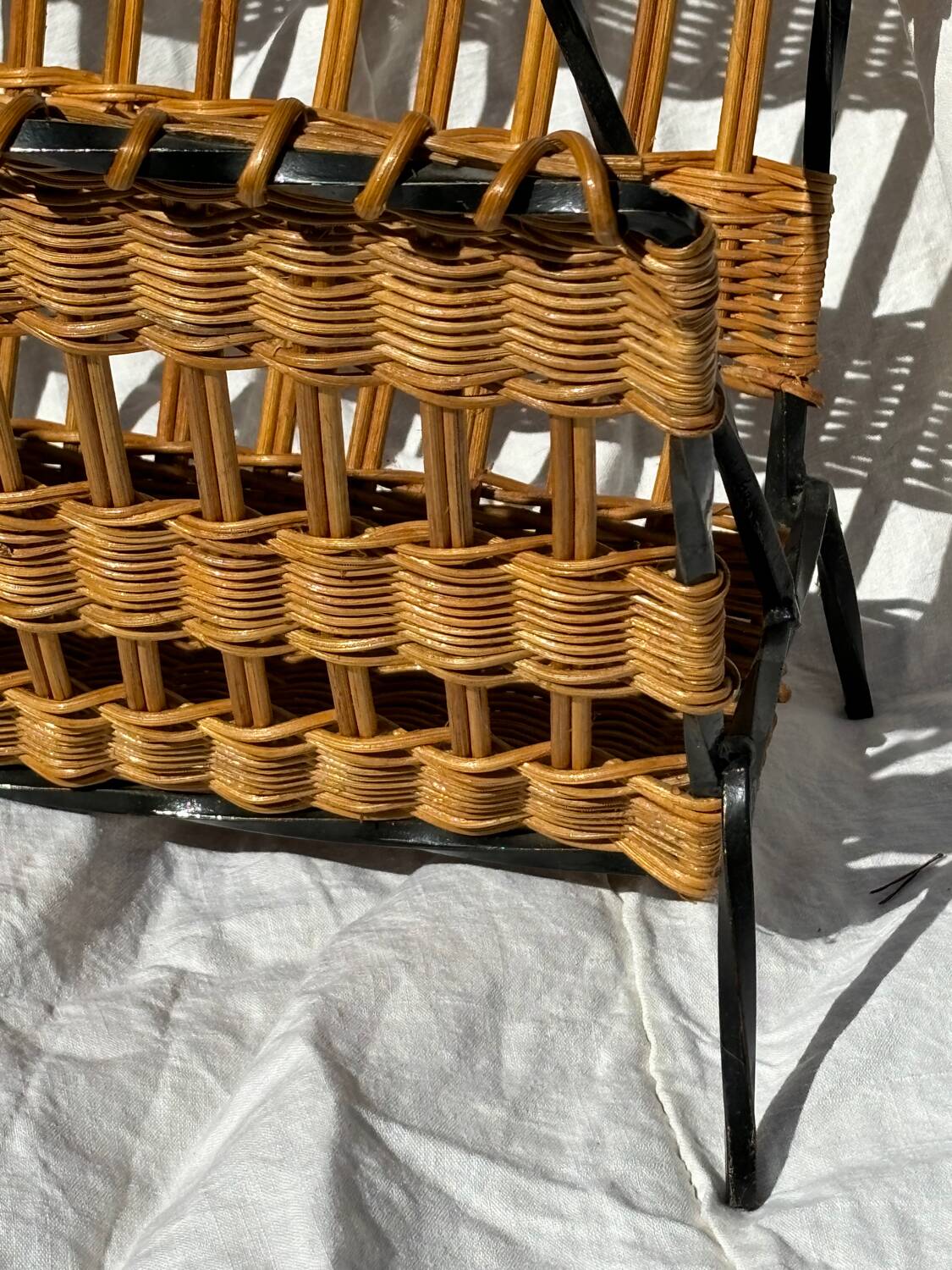 Vintage metal and wicker magazine rack