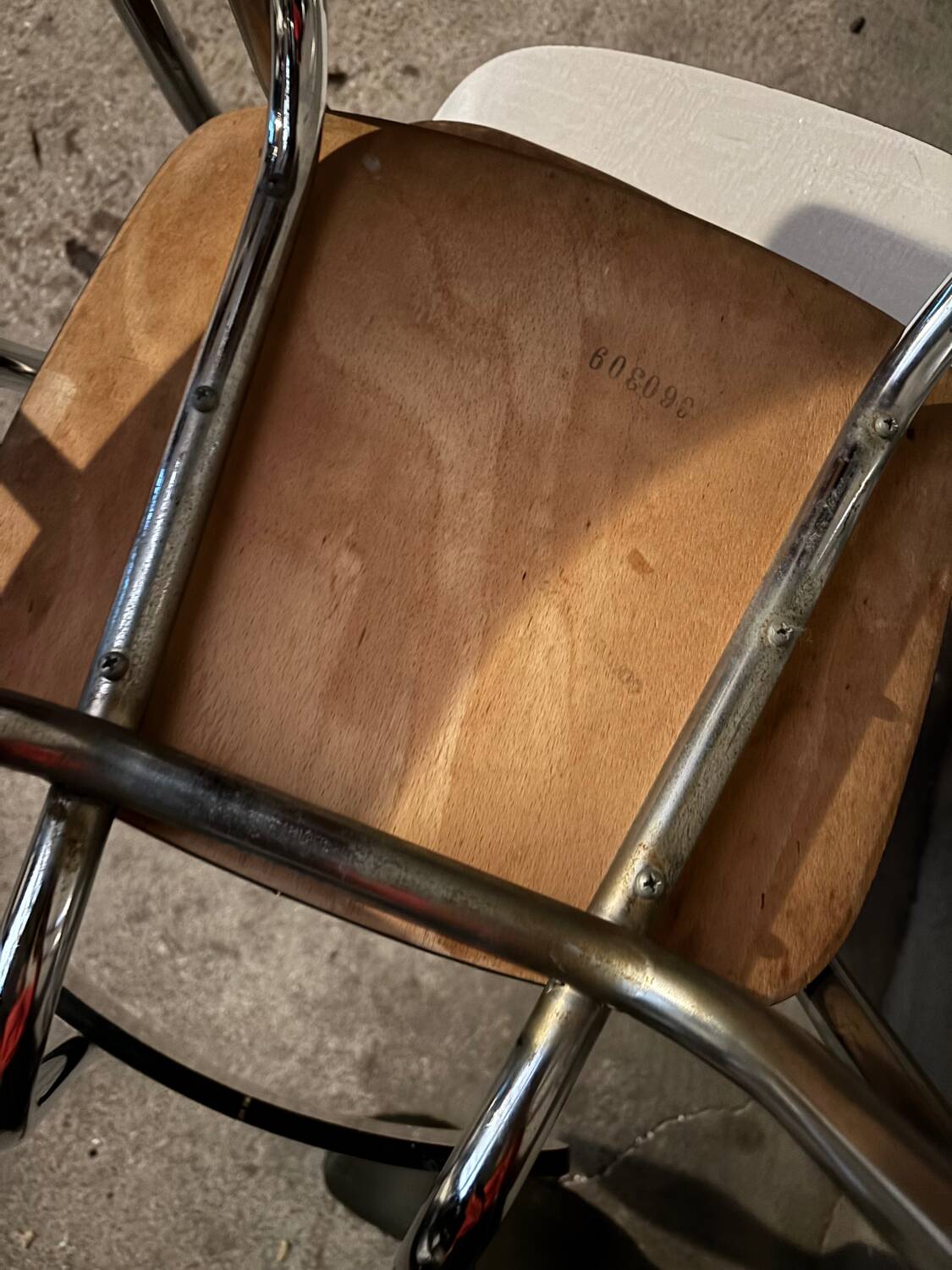 3 white Formica chairs
