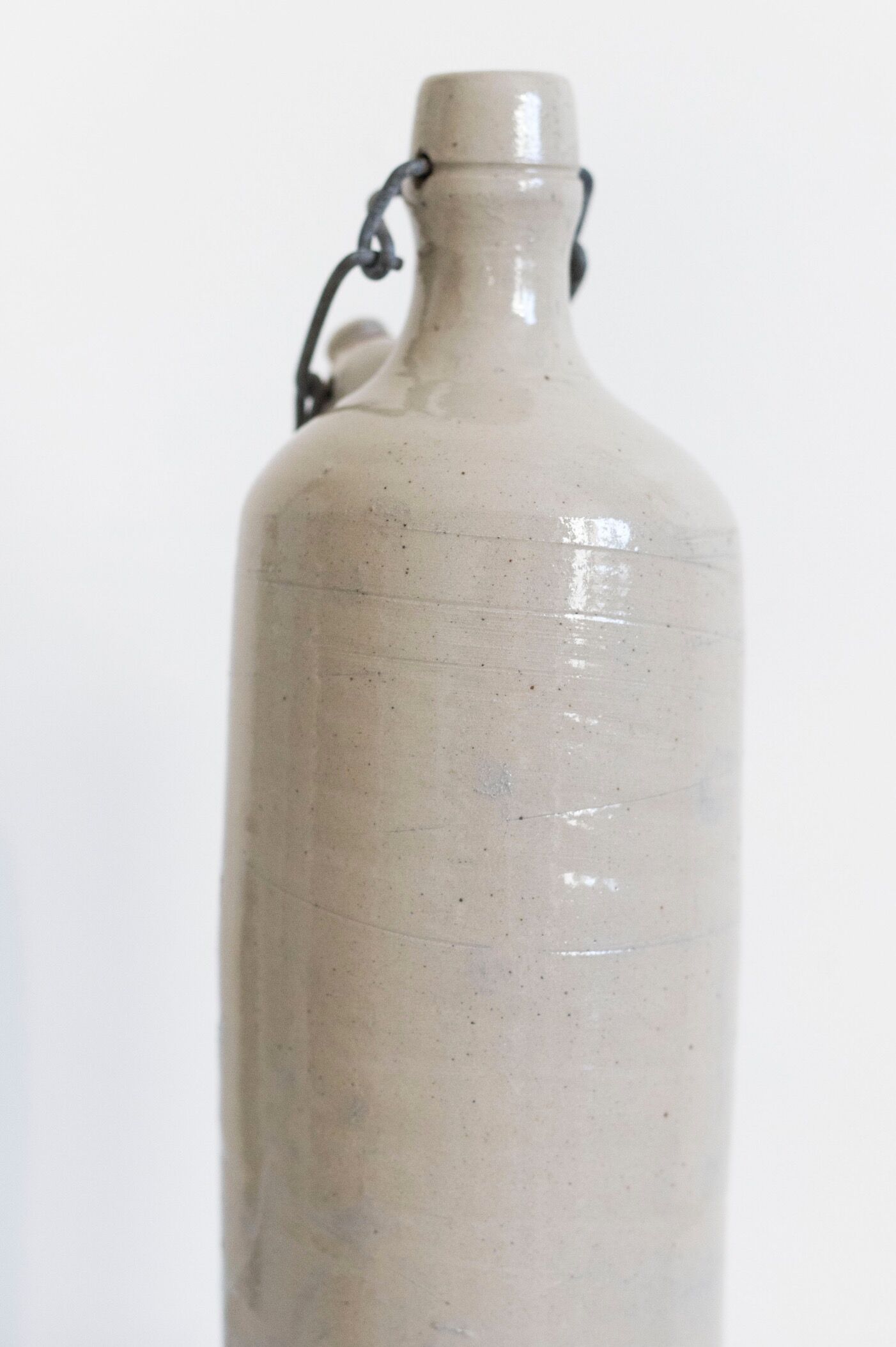 Bottle of enamelled stoneware hot water bottle