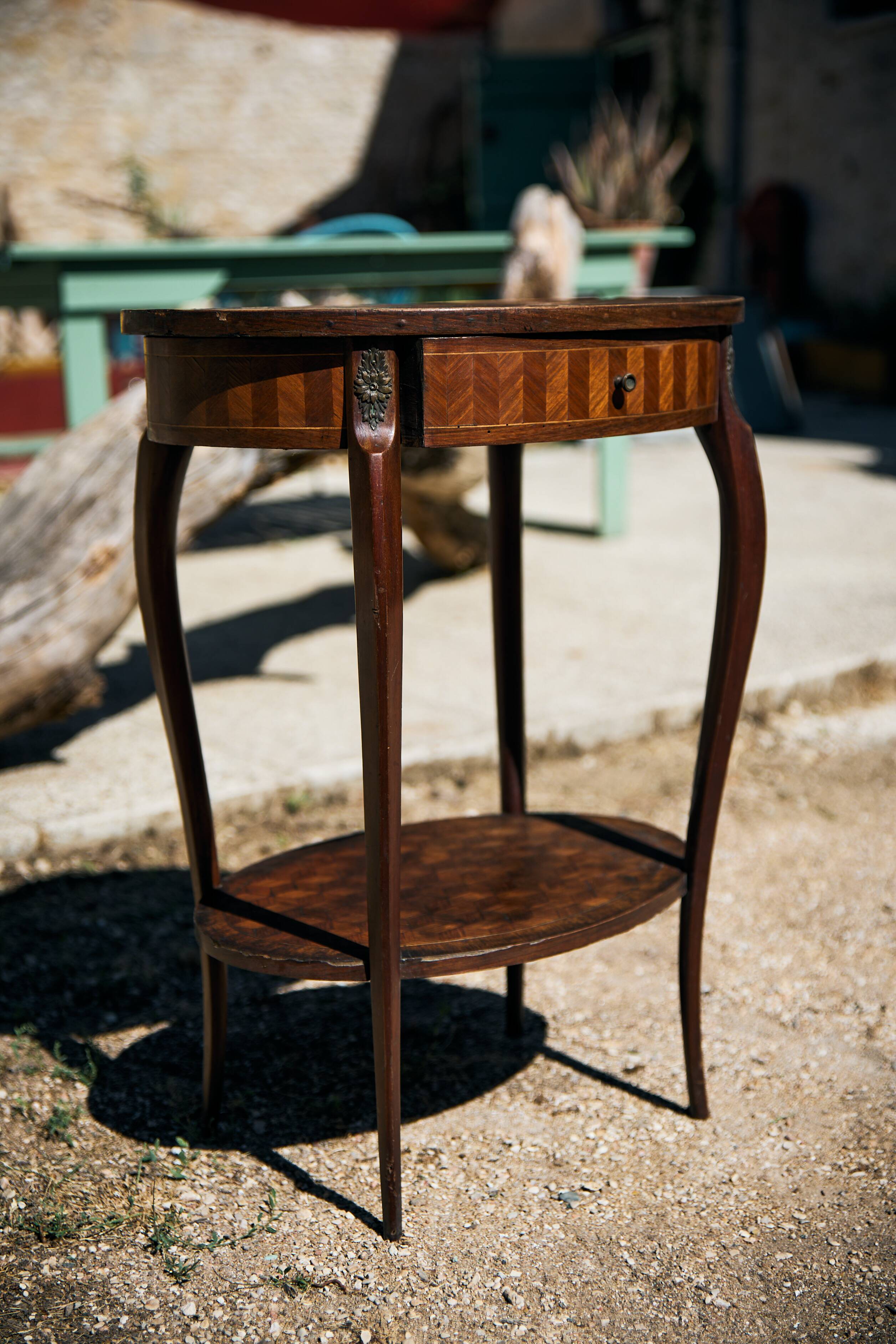 Oval coffee table in cube marquetry and bronze, Louis XV style.