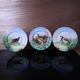 3 decorative porcelain plates from Limoges featuring partridges and pheasants.