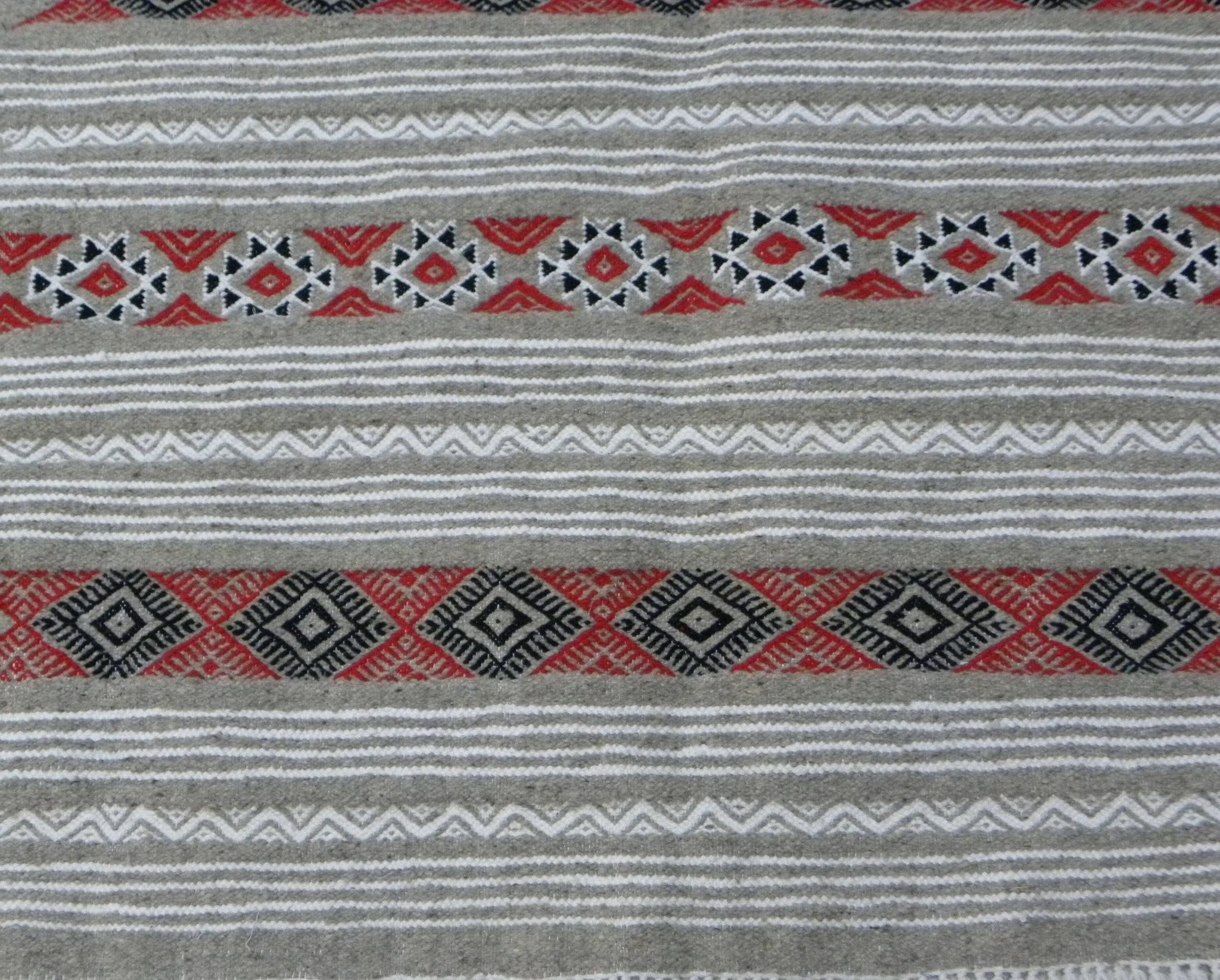 Geometric woven rug with fringes – Ethnic style – Hallway & interior