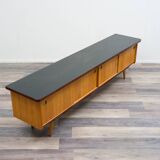 1950s low sideboard in ash, black formica surface. Professionally restored