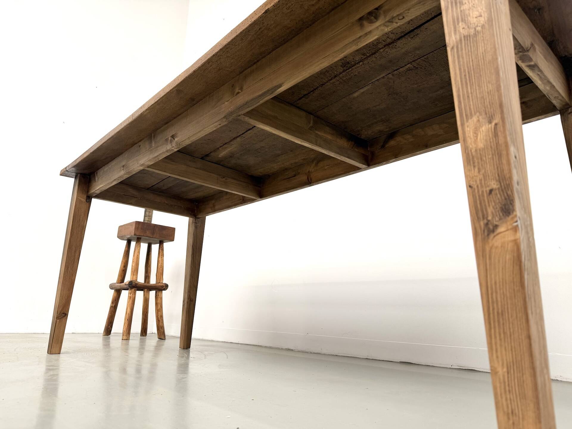 Farm table in walnut with spindle legs.
